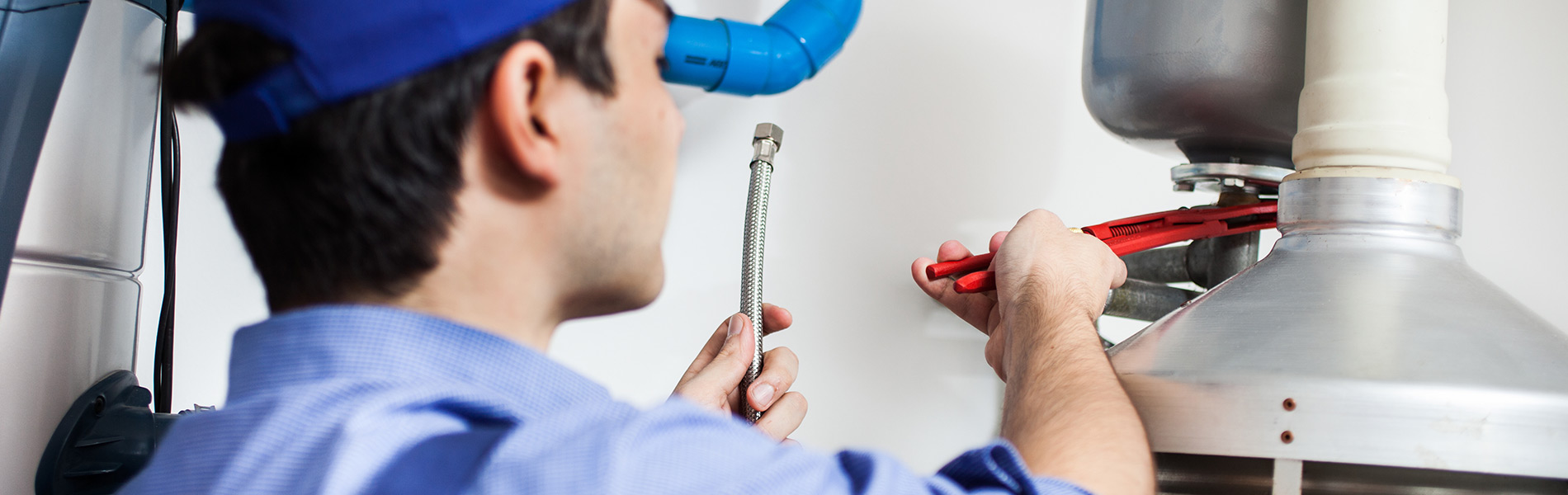 Plumber fixing water heater